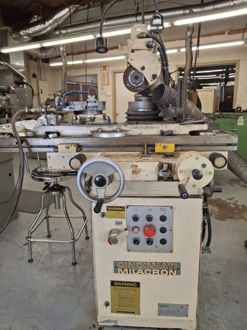 Industrial grinding machine in a workshop.